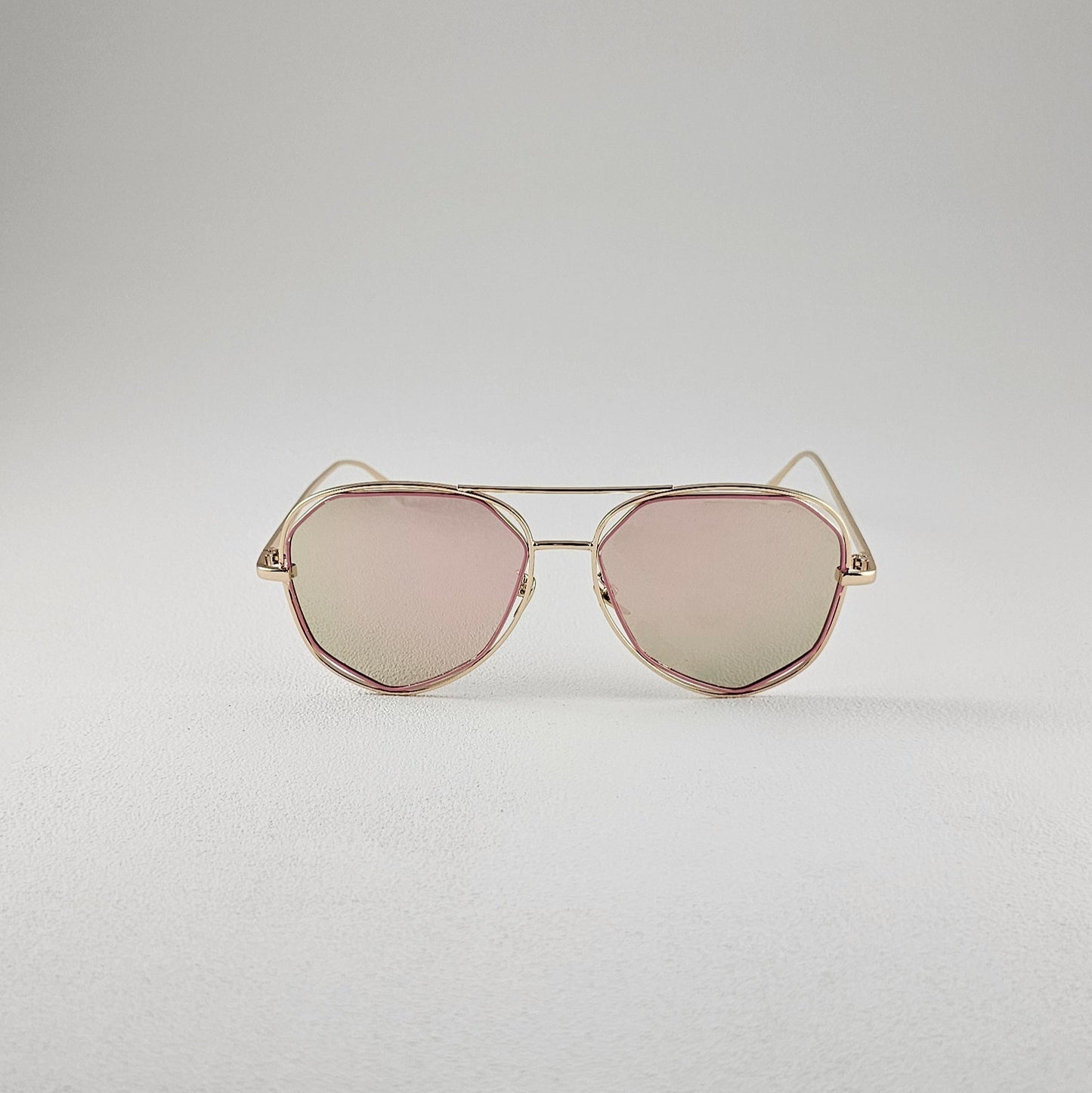Pink geometric polarized sunglasses with UV protection – metal frame front view