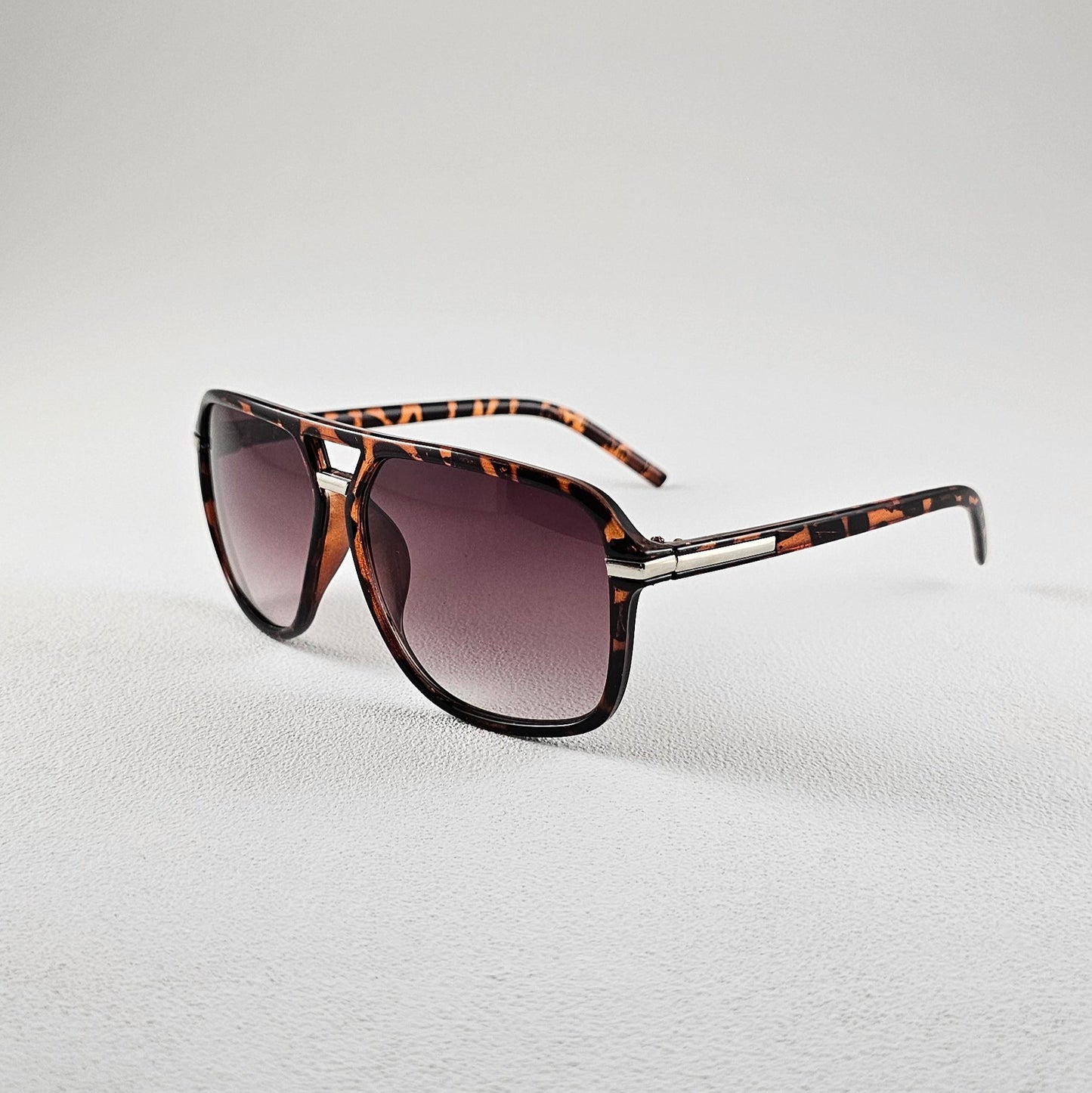 Angled view leopard polarized geometric sunglasses with AC lenses and UV protection