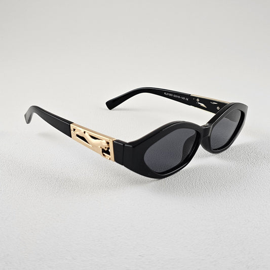 Women's Angela oval sunglasses side view black frame gold detail UV400 lenses