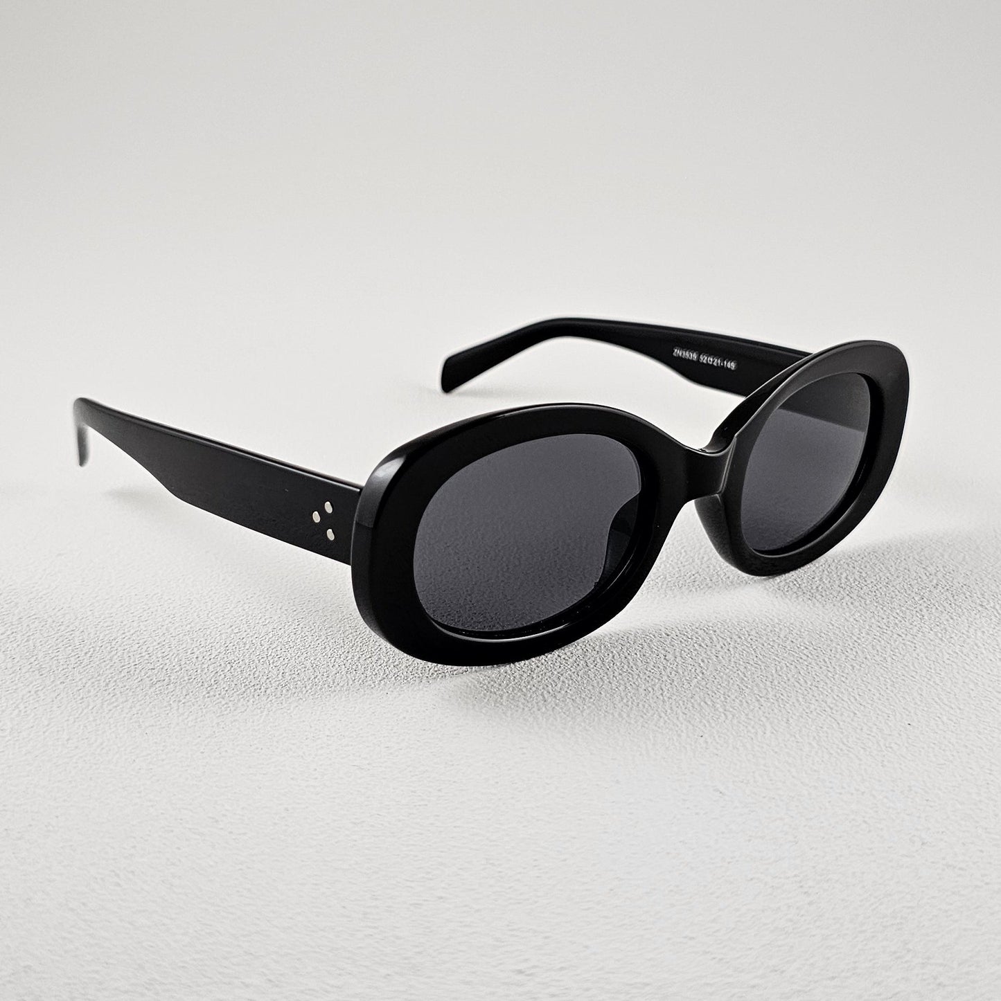 Women's Lisboa oval sunglasses black bold frame side view UV400 lenses