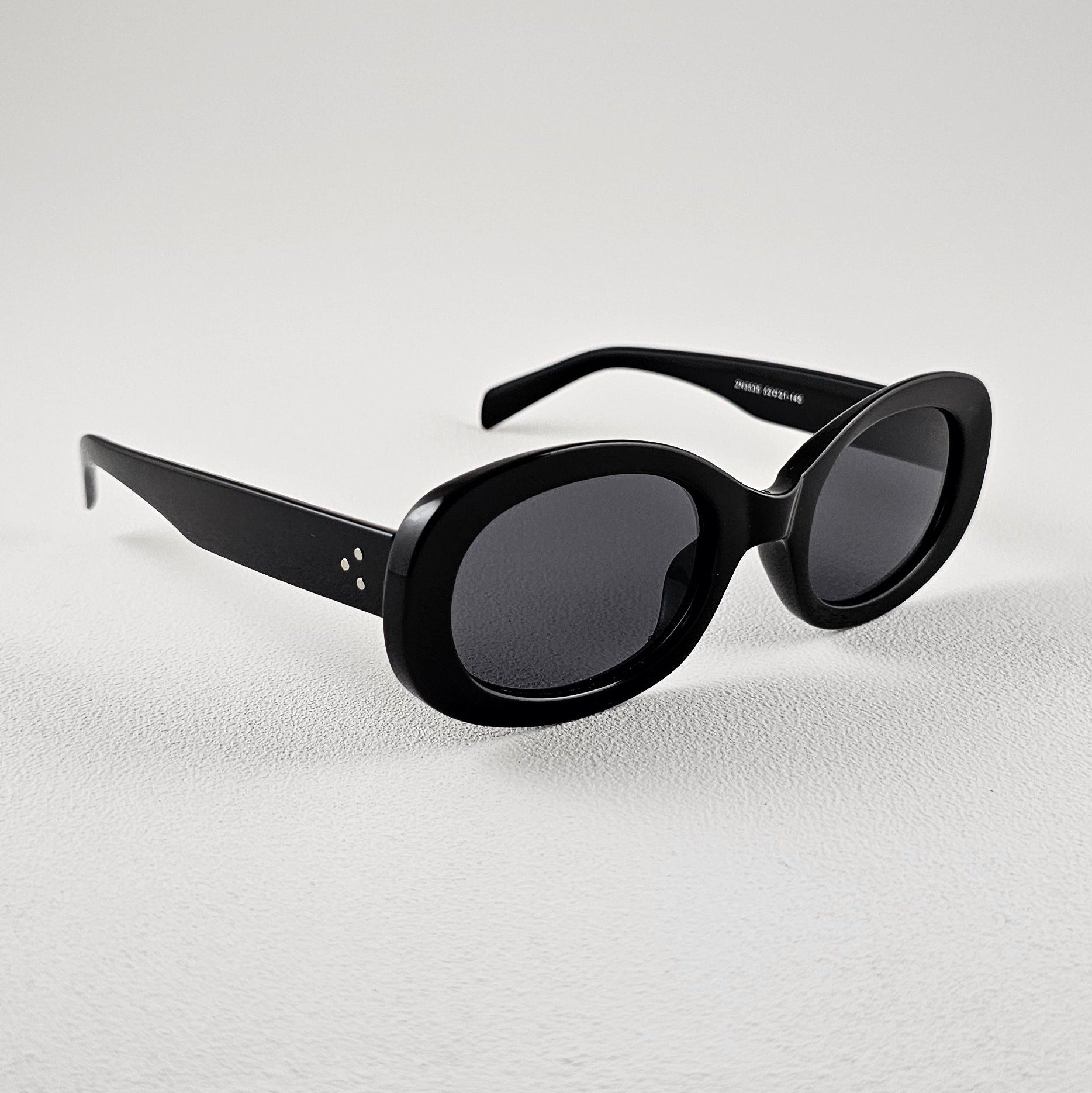 Women's Lisboa oval sunglasses black bold frame side view UV400 lenses
