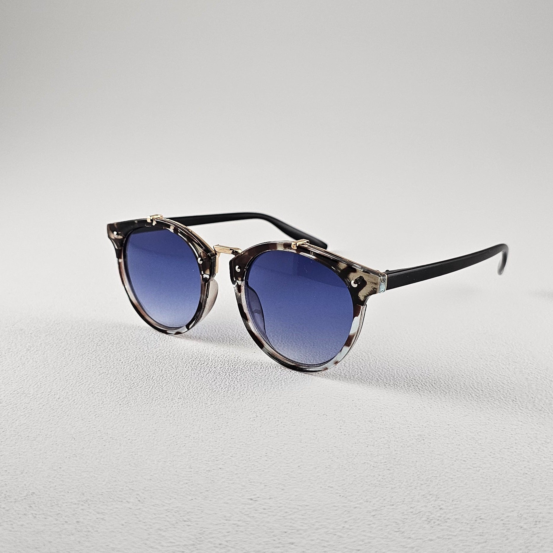 Angled view round polarized sunglasses with polycarbonate lenses and UV protection